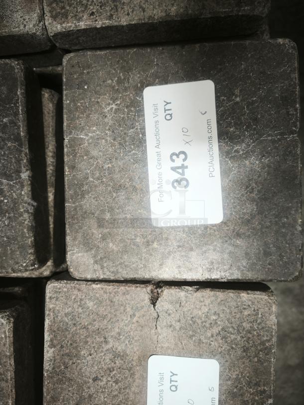 NSF certified volcanic granite slabs for cooking, showing quantity label "343 x 10," textured surface in good condition.