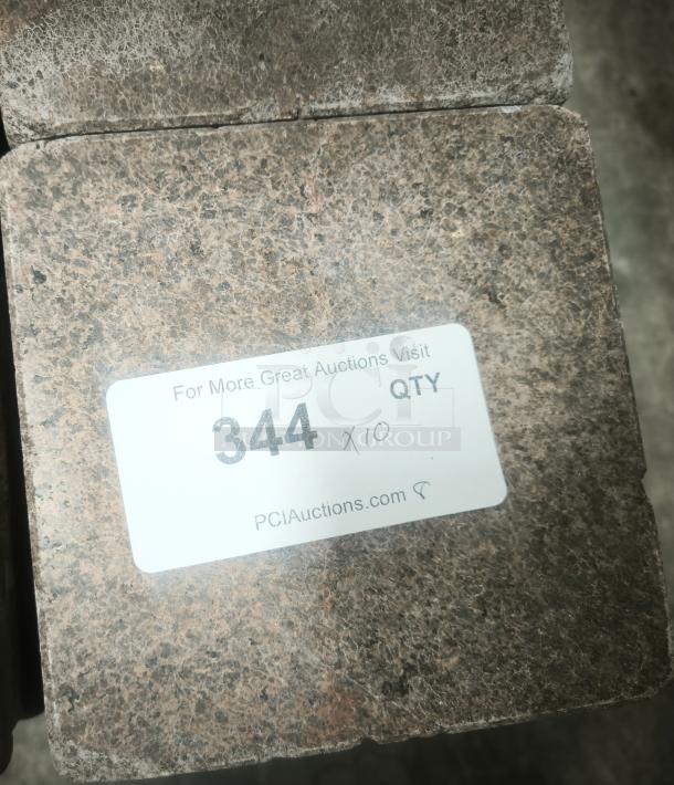 NSF Certified volcanic granite slab for cooking, textured surface, label reads "344 x10" from PCIAuctions.com.