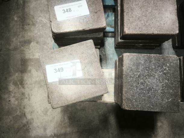 NSF certified volcanic granite slabs for cooking, stack of 10, with visible auction tags "348" and "349".