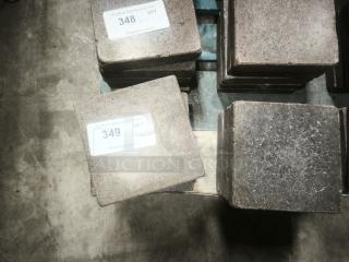 NSF certified volcanic granite slabs for cooking, stack of 10, with visible auction tags "348" and "349".