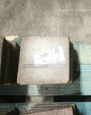 NSF certified volcanic granite slab for cooking, square, shown on pallet. Label displaying quantity of 350.