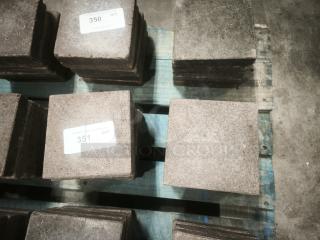 NSF certified volcanic granite slabs for cooking, shown stacked on a pallet. Labels indicate quantities, highlighting commercial use.