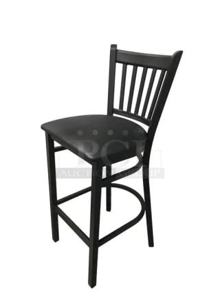 Black metal bar stool with channel back, featuring a black vinyl seat. Sturdy design, good condition. Ideal for bars and kitchens.