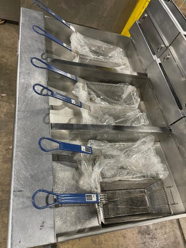 Pitco SG14-JS commercial stainless steel 40 lb. triple-bay deep fat fryer with digital control, backsplash, basket hanger, and fry baskets.