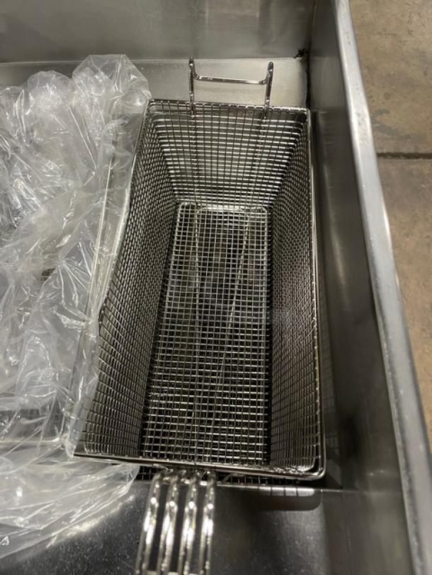 Pitco SG14-JS commercial stainless steel 40 lb. triple-bay deep fryer system with digital control, basket hanger, and fry basket.