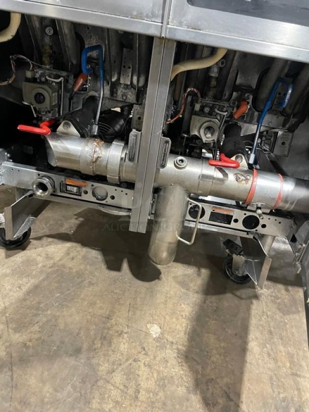 Pitco SG14-JS commercial gas fryer, 40 lb capacity, digital control, on casters, with backsplash and basket hanger.