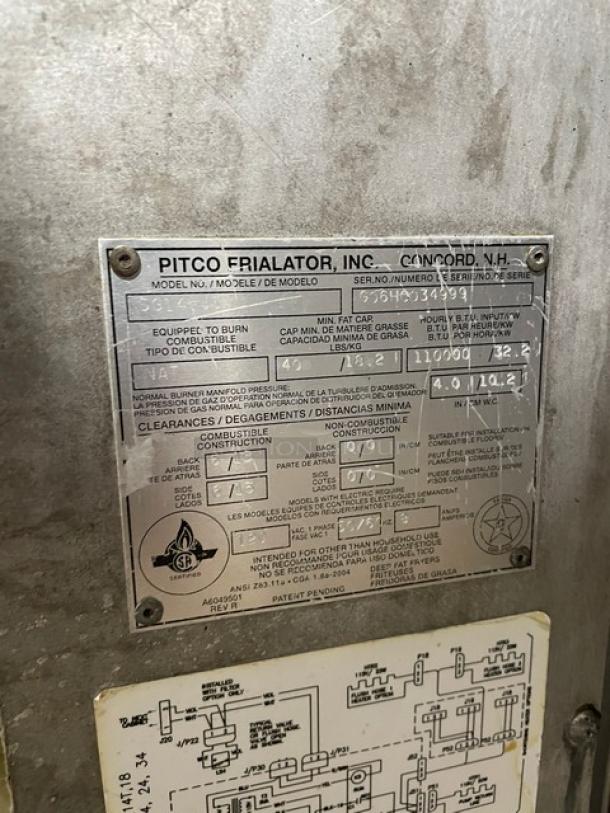 Pitco SG14-JS deep fryer system, stainless steel, triple-bay, natural gas, 40 lb capacity, digital control, casters, model and serial number plate visible.