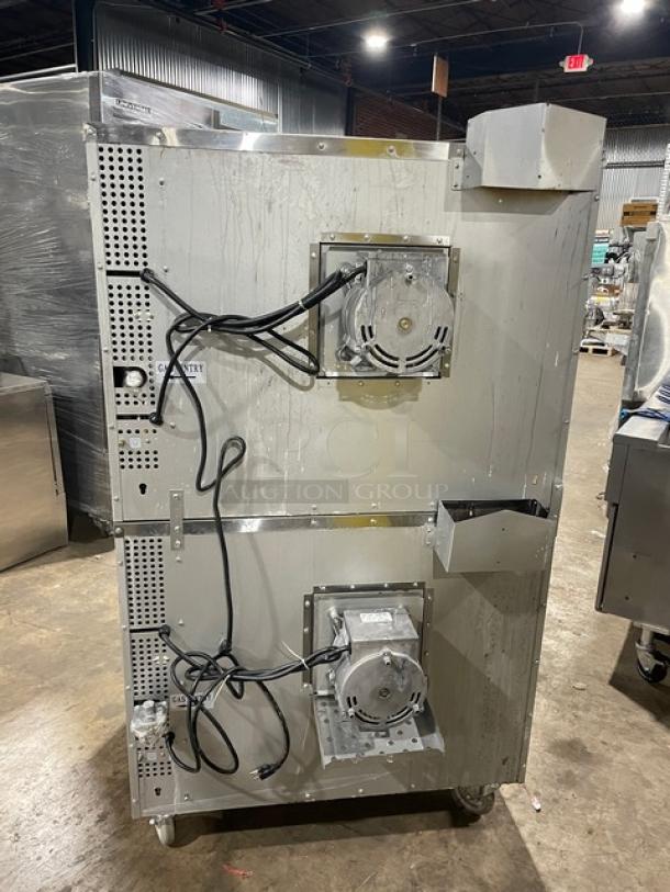 CPG stainless steel double-stacked convection oven, model FGC100, on casters. Features thermostatic control, wired rack, natural gas powered, 120V 1 Phase.