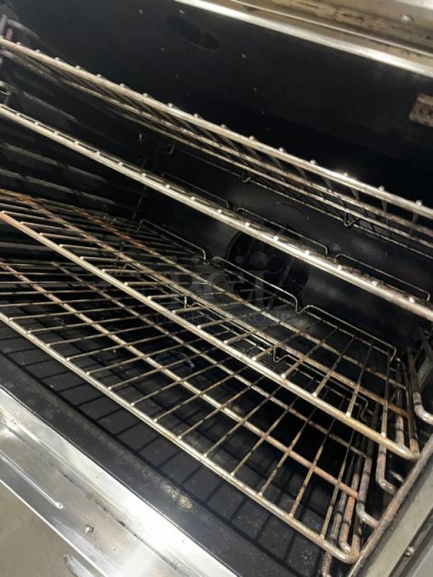CPG FGC100 stainless steel double-stacked convection oven, natural gas, wired rack, thermostatic control, 120V, on casters.