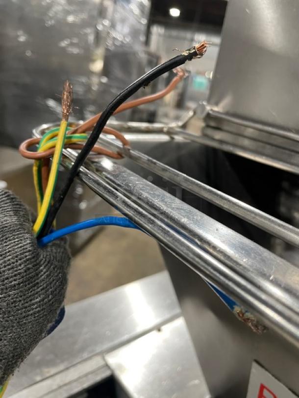 La Baresina stainless steel electric conveyor pasta machine, model BARESINA5.5, showing exposed wiring.