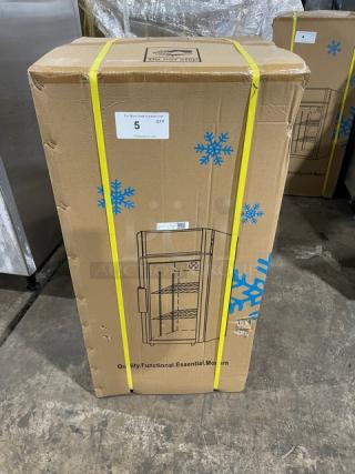 New ProCool T-80L commercial black glass door countertop refrigerator in box. Model T80L, features cooling display.