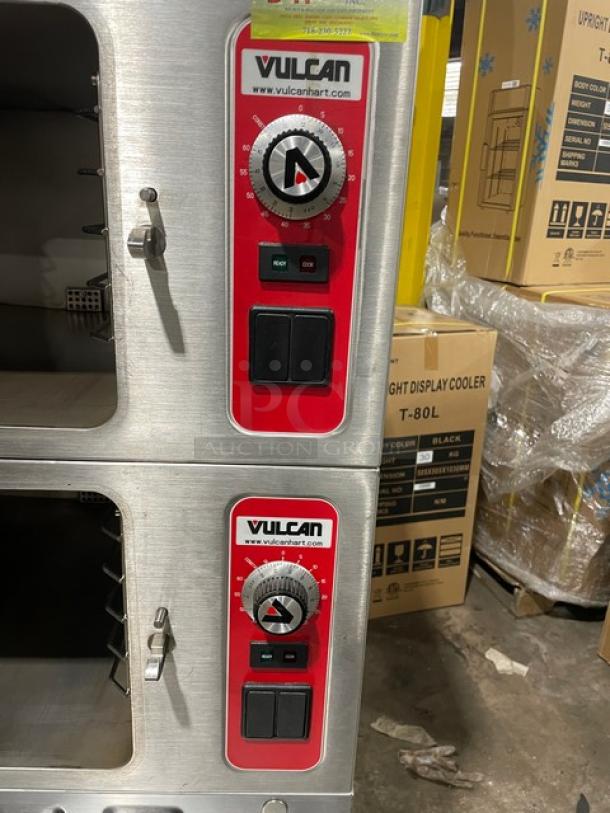 Vulcan VSX24G dual compartment convection steamer, stainless steel, natural gas, with controls and built-in pan rack, on legs.