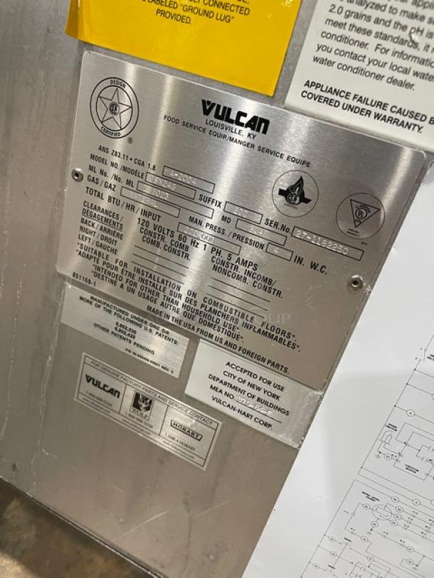Vulcan VSX24G Boiler Base Series stainless steel convection steamer, dual compartment, natural gas, model VSX24G, serial 27-1182250, with individual controls and built-in pan holding rack, 120V 1 Phase, on legs. Visible labels indicate model and specifications.