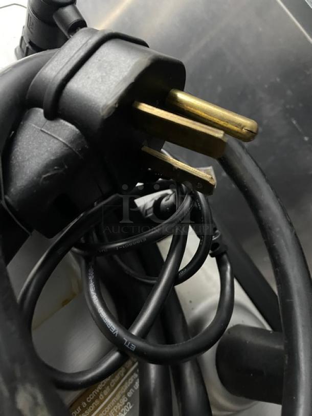 Power cable for MerryChef Eikon E2S countertop high-speed oven, showcasing three-prong plug; essential connection detail.