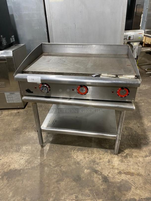 Star Max Series 36" stainless steel electric countertop griddle with back and side splash, on legged undershelf stand.