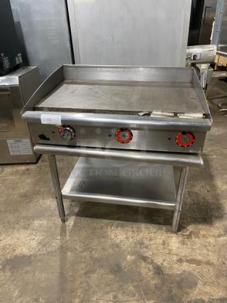 Star Max Series 36" stainless steel electric countertop griddle with back and side splash, on legged undershelf stand.