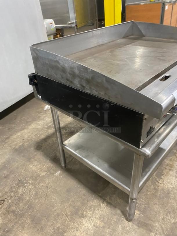 Star Max Series 36" stainless steel electric griddle with back and side splash, single undershelf stand, on legs.