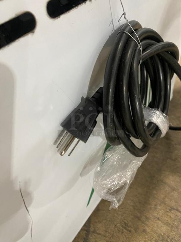 Power cord of commercial ice cream machine, model ICM-12, 2023, SN: 20231102, 110V, coiled for auction listing.