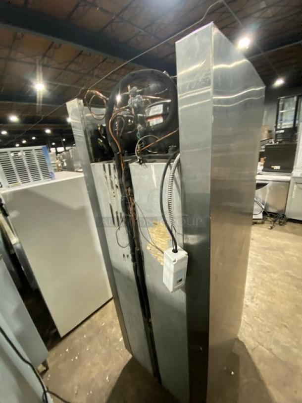 Traulsen RDT132WUT commercial stainless steel reach-in refrigerator/freezer combo. Built-in pan slide, chrome rack, model label visible.