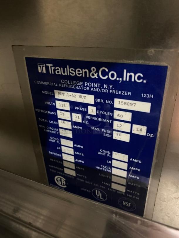 Traulsen model RDT132WUT label showing specs: 115V, 1-phase, SN 158897, with refrigerant details and certifications.