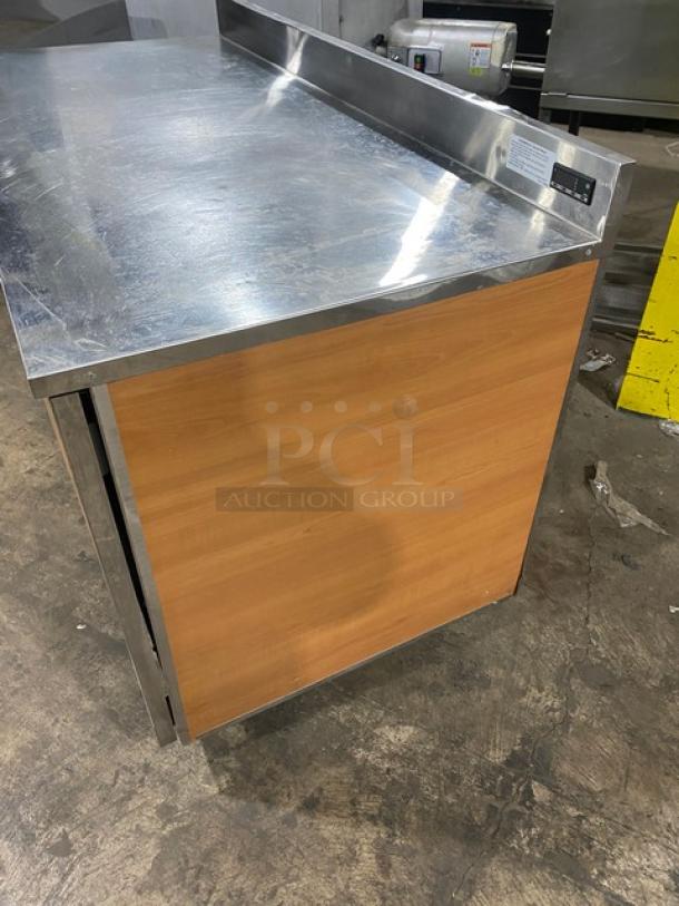 Duke RBC60M commercial refrigerator, stainless steel, 2-door, 60" worktop with upturned backsplash, on legs, SN: 09135680.