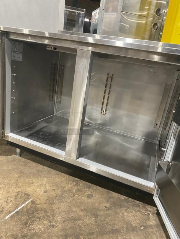 Duke RBC-60M stainless steel 2-door worktop refrigerator, 60", up-turned backsplash, on legs, model label visible, good condition.