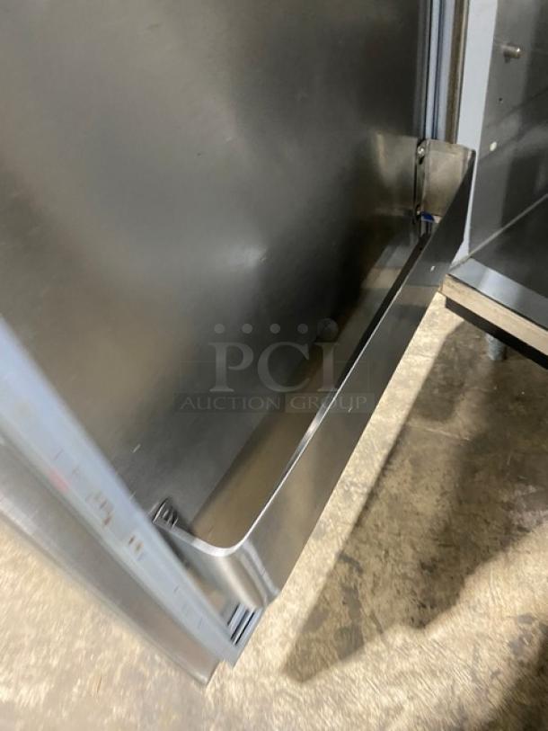 Duke Commercial 2-Door Stainless Steel Worktop Refrigerator, Model RBC60M, with upturned back splash and legs, SN: 09135680.