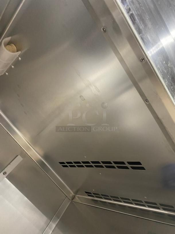 Traulsen stainless steel roll-in refrigerator interior, Model RRI1-32LUT, 115V, single door, clean and well-maintained condition.