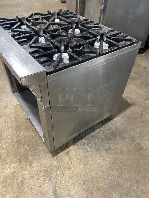 U.S. Range commercial 6-burner stainless steel gas range with enclosed dry cabinet storage base on casters.