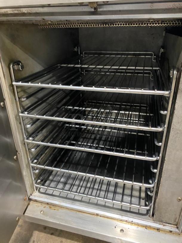 Hobart CN85 stainless steel convection oven, wired rack, thermostatic control, on legs, 208V 1-3 phase, good condition.