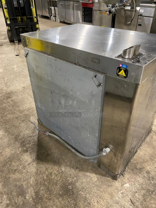 Alto-Shaam countertop rotisserie oven, stainless steel, electric, digital controls, visible wear, commercial use.