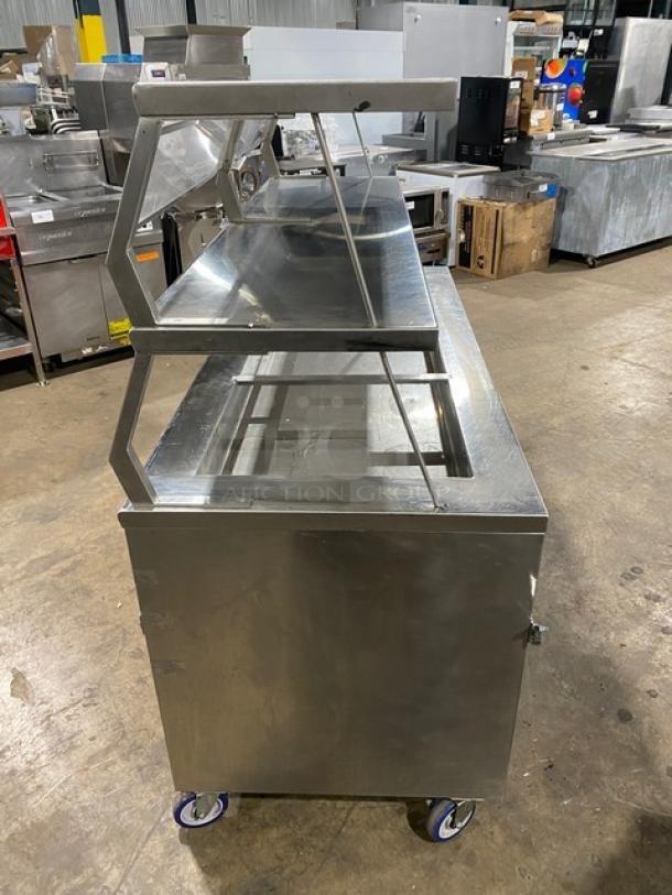 Precision SST-2024 refrigerated salad bar with stainless steel finish, double overhead shelf, enclosed dry base, on casters.