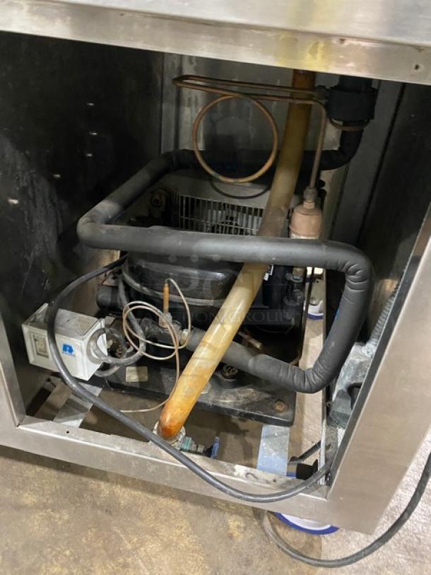 Precision SST2024RTNYC refrigerated cold food bar interior showing compressor and electrical wiring, good condition.