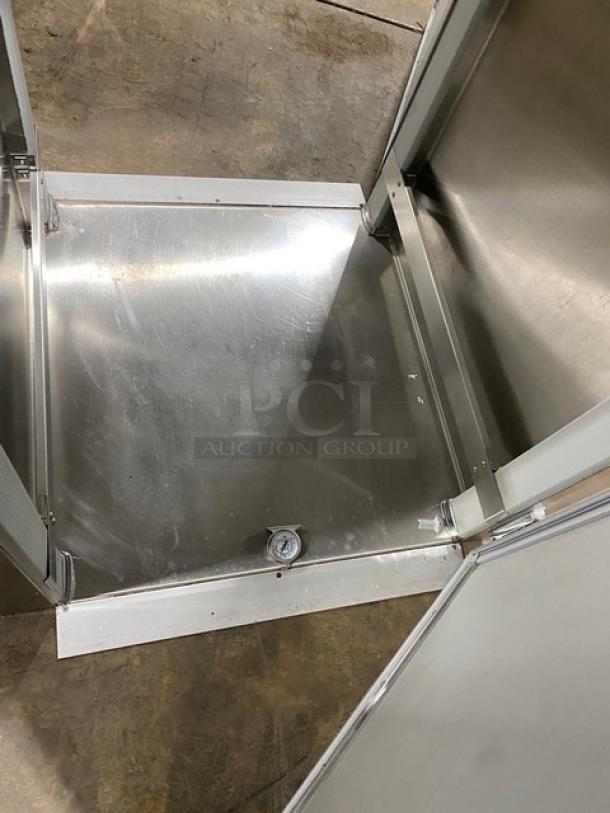 Victory RIS1DS7PT stainless steel roll-in pass-thru refrigerator, single door open, durable construction, commercial use.