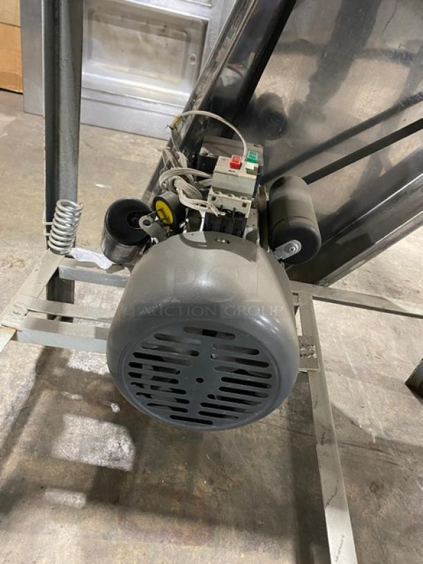 Commercial stainless steel electric dough roller/sheeter, free-standing, high-speed, with visible motor and legs.