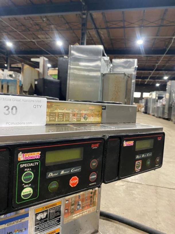Bunn AXIOM2/2TWIN coffee brewer with digital controls, stainless steel, 4 warming plates, Dunkin’ Donuts label, SN: AXTN015795.