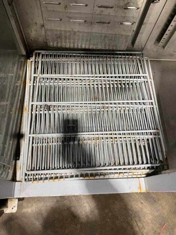 Hoshizaki stainless steel 2-door reach-in refrigerator, model CR2SFS, with poly coated wire rack, on casters.
