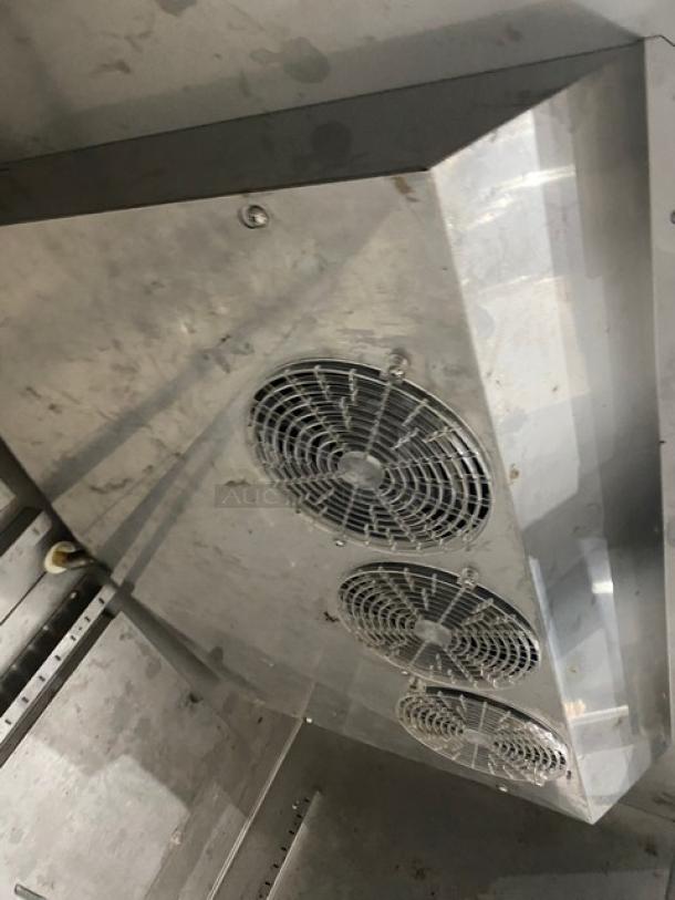 Hoshizaki CR2S-FS stainless steel commercial refrigerator interior showing fan and rack, on casters, with model label.