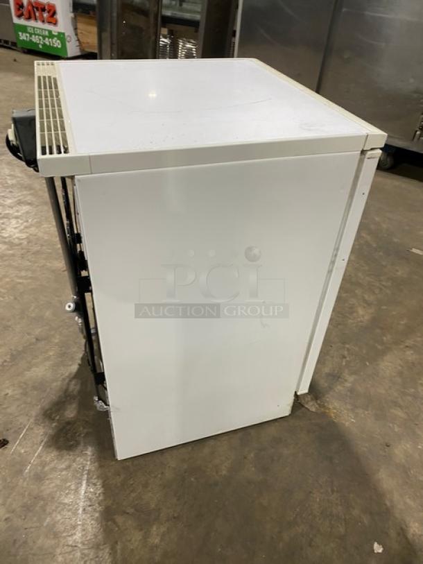Fisher Scientific white undercounter flammable materials storage unit, model 979381, featuring a poly-coated wired rack.