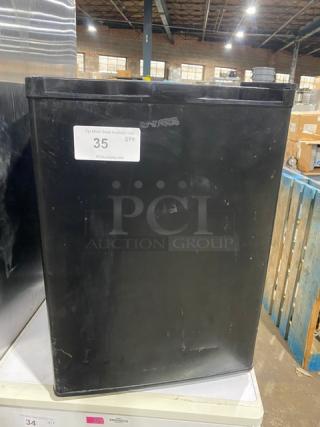 Antarctic BD-60-E compact upright freezer, black, single door, poly-coated wire rack, 115V, model BD60E, visible surface scuff marks.