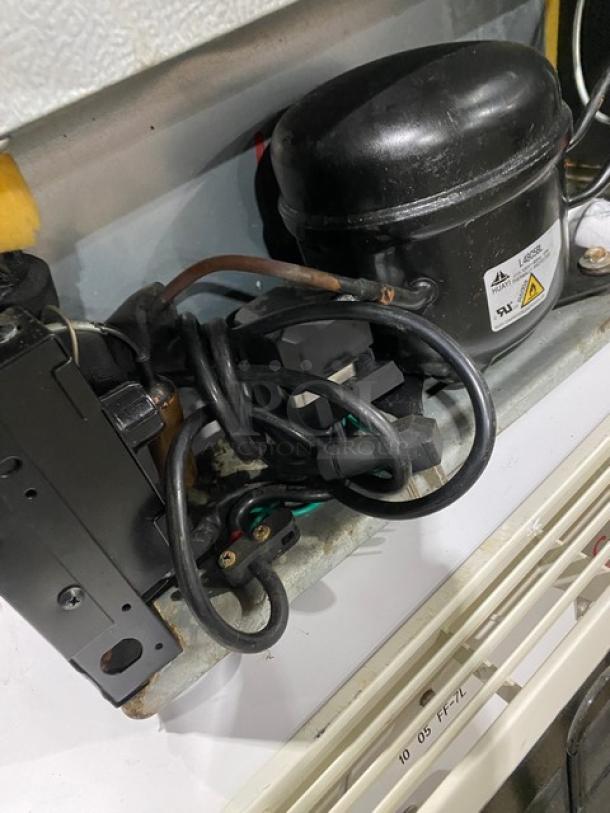 Antarctic BD60E compact upright freezer compressor; black, single door, poly-coated rack, 115V, commercial use, late model 2020.