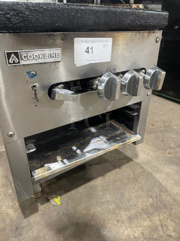 Cookline stainless steel gas-powered double stock pot range with front controls, on legs. Visible wear, auction tag 41.