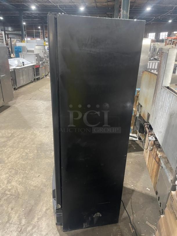 Imbera Elite Series G319 black commercial refrigerator, single glass door, poly-coated wired rack, Energy Star certified, on legs.
