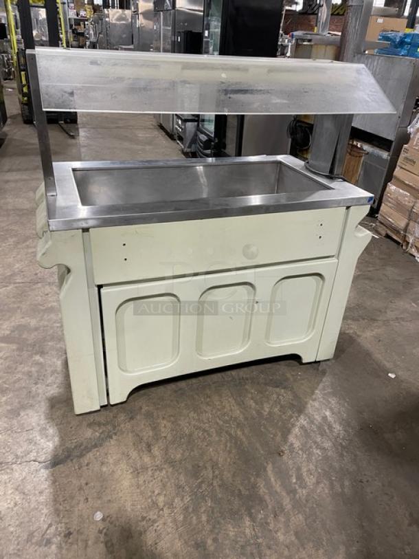 Custom buffet-style stainless steel portable refrigerated salad bar with sneeze guard, folding tray slide, and casters.