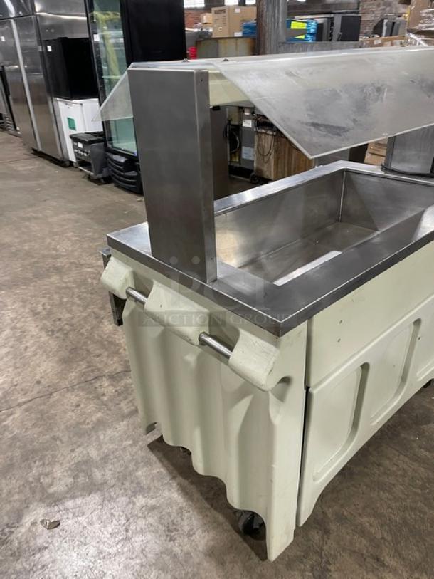 Custom buffet style stainless steel portable refrigerated salad bar with sneeze guard, folding tray slide, and casters.