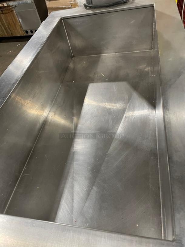 Stainless steel portable refrigerated cold food/salad bar with sneeze guard, folding tray slide, and casters. Commercial use.