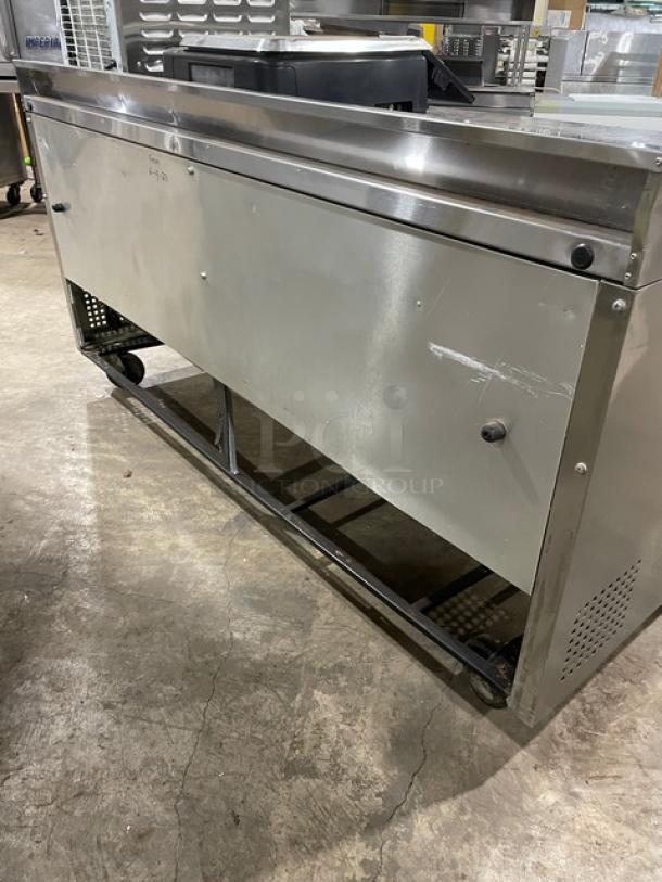 True 3-door worktop refrigerator, stainless steel, 72", Model TWT-72, Energy Star certified, with upturned backsplash, on casters.