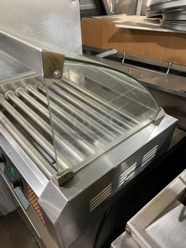 Great Northern Popcorn Mad Dog Series 4330 stainless steel hotdog machine, 9 rollers, tempered glass sneeze guard, 120V.