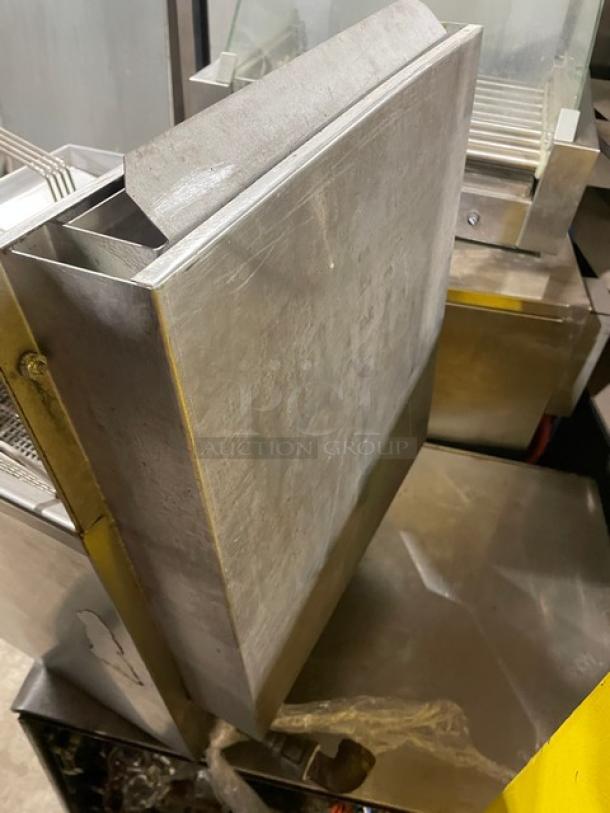 Commercial stainless steel gas-powered countertop deep fat fryer with backsplash and fry basket visible. Good condition.