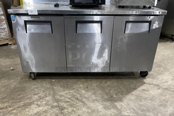 True TWT-72 stainless steel 3-door worktop refrigerator, Energy Star certified, upturned backsplash, on casters, model TWT72.